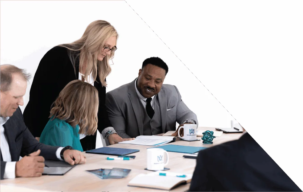 McEntire Advisor reviewing financial reports with team, providing specialized accounting services for business litigation and expert witness support.